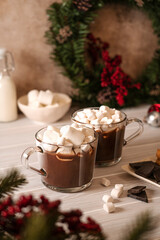 Obraz na płótnie Canvas Two mugs with hot chocolate with white mini marshmallow