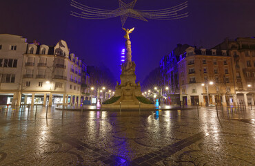 Fototapeta na wymiar Ancient monumental fountain Sube with golden angel at top was erected in middle of Place d'Erlon. Champagne-ardenne, France