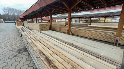 Fototapeta premium Wood processing. Joinery work. wooden furniture. Wood timber construction material for background and texture. details wood production. composition wood products.