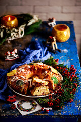 Fototapeta na wymiar Bolo Rei .Traditional Portuguese Christmas cake on a Christmas rustic background