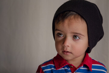 close portrait of little boy wearing balaclava