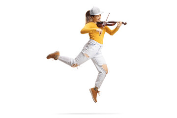Full length shot of a modern female artist dancing and playing a violin