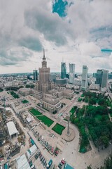Aerial view of palace of art and culture in Warsaw, Poland on a cloudy and rainy afternoon. wide...