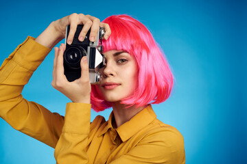 pretty woman with pink hair photographer with camera creative profession