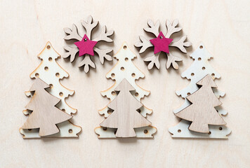 holiday background with snowflake, star, and tree shapes