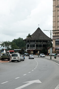 "Kuching,Malaysia-Circa December, 2021: A picture The White Barouk building with traffic insight. The area will be among busy streets during Sarawak State Election."