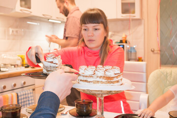Celebration in the bosom of the family with a cake at the table