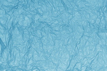 Crumpled paper texture. Abstract blue background  