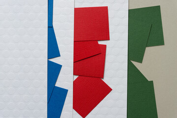 background with blue, red, and green paper squares