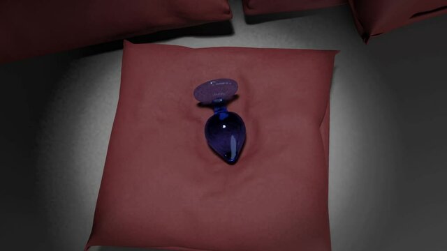 A blue glass butt plug on a red pillow is under a gradually increasing spot light. 3d render