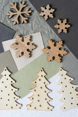 unpainted christmas decorations arranged on paper