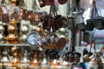 Fototapeta na wymiar Sale of traditional Turkish Turks for making coffee at the Turkish market in Istanbul