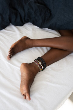 Sleeping woman with ankle bracelet