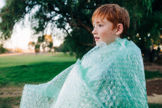 Child wrapped in bubble wrap