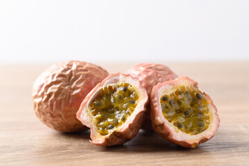Overripe passion fruit on wooden background