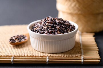 Thai purple glutinous rice grain in bowl, Organic and healthy food