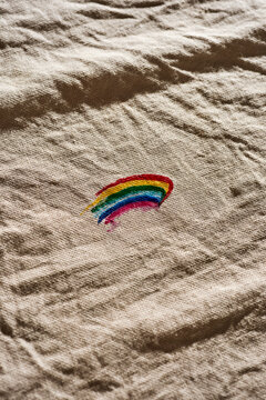 rainbow flag on an unironed beige fabric