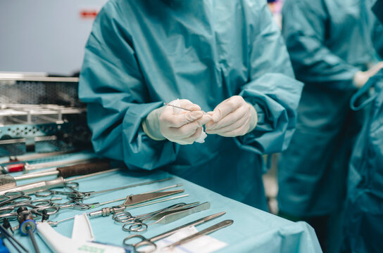 Surgical staff with instruments in hospital