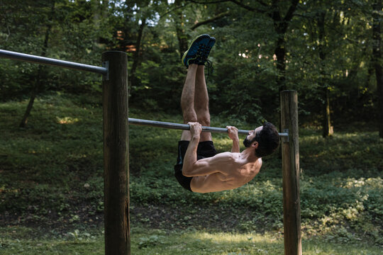 Young Man Exercising Outdoors In Nature on
