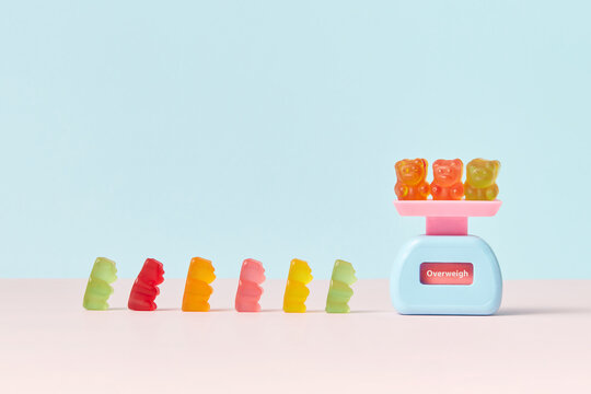 Scales and row of gummy bears