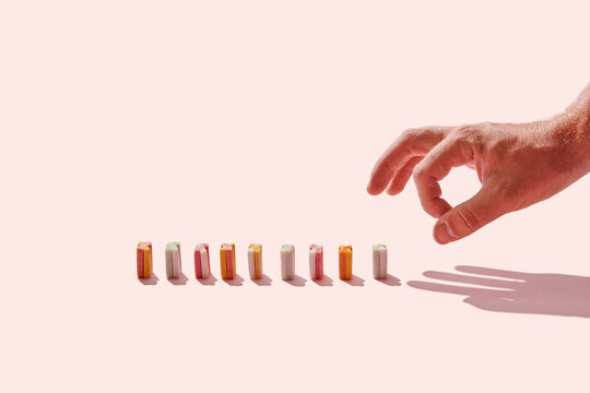 Man swinging hand at chewing gums