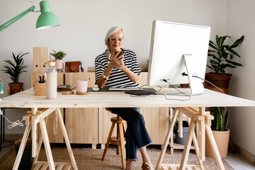Woman using her phone at office