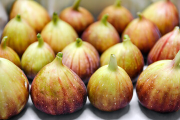 ripe fresh figs fruit in basket background