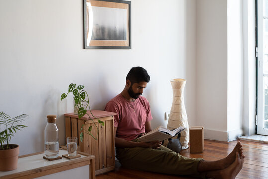 Simple interiors for a man reading on the floor