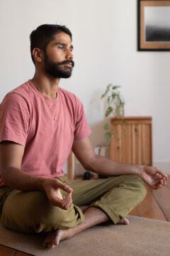 Lotus position for a man practising at home