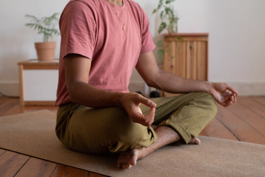 Sufi man practising meditation in the living room