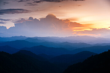 Majestic sunset sky over blue mountains landscape