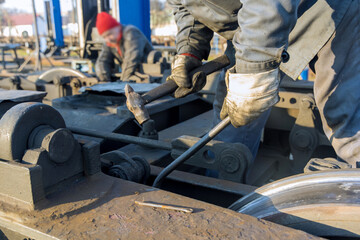 Close up train wheel removed from train for maintenance in depot main workshop