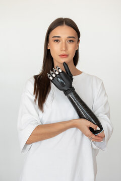 Portrait of a young woman with a prosthesis on her arm