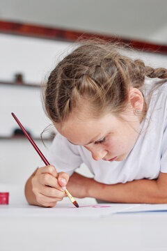 Girl painting at school 