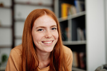 Portrait of successful and cheerful  female student 