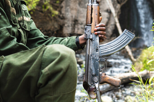 Unrecognizable man holding a weapon