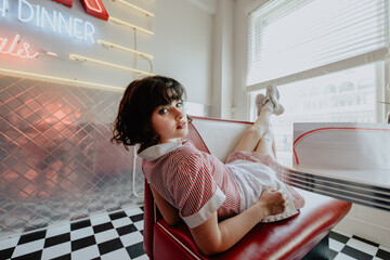 1950s Diner Waitress Relaxing in Booth