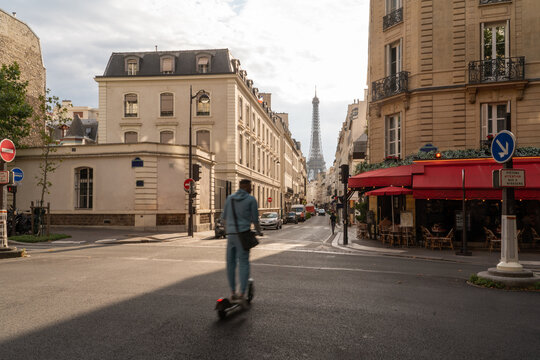 Man Crossing Street With Eiffel Tower View