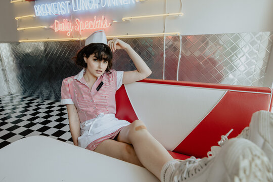 Diner Waitress Kicking Back In Booth 