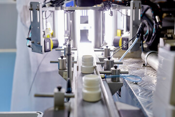 Plastic bottles on conveyor at factory