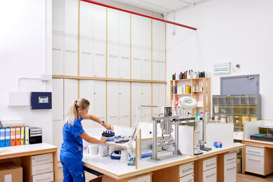 Scientist checking plastic bottles in lab