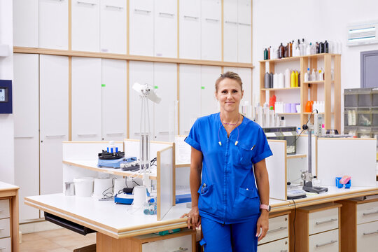Smiling scientist in modern laboratory