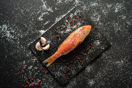 Cooked fish on slate
