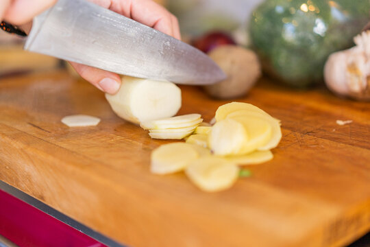Cutting vegetables on cutting board
