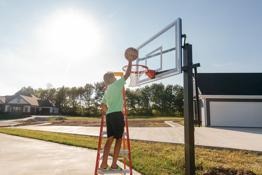 First basket on new basketball pole. 