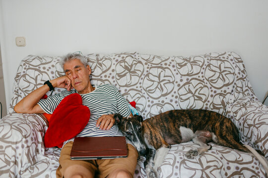Man and dog napping