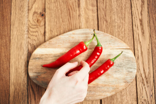 red hot chili peppers on a wooden board kitchen ingredients