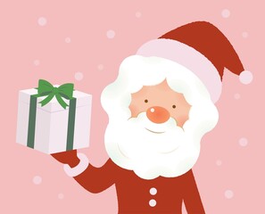 雪の中プレゼントを手にするサンタクロース