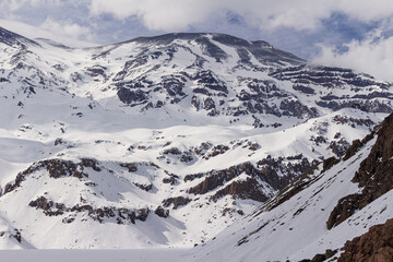 Fototapeta na wymiar Snowed mountains in La Egorda Valley, Cajón del Maipo, central Andes mountain range, Chile