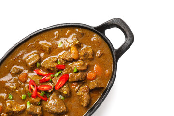 Dish with tasty beef curry on white background